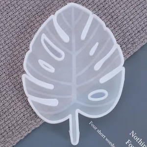 Close-up of a translucent monstera leaf shaped silicone mold for DIY resin craft projects