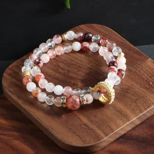 Elegant natural red ghost quartz multi-strand bracelet with a golden textured running ring