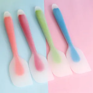 Close-up of four colorful heat-resistant silicone spatulas for professional baking