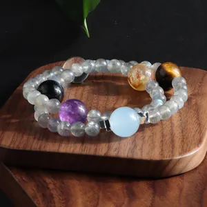 Close-up detail of double-layer grey moonstone bracelet featuring multi-color gemstones.
