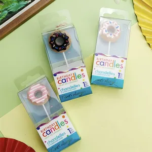Cute donut shaped birthday candles in individual clear box packaging for party