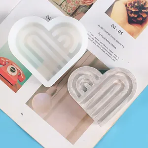 Detail view of heart-shaped rainbow silicone mold for DIY candle and soap making