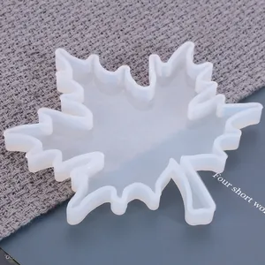 Close-up detail of a transparent maple leaf silicone mold for DIY resin coaster making