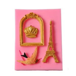 Detailed macro shot of a pink silicone mold with crown, frame and Eiffel Tower shapes.
