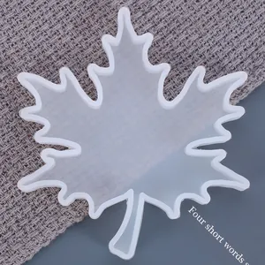 Close-up detail of a translucent maple leaf shaped silicone mold for DIY resin craft projects