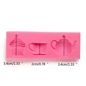 Pink silicone mold with tea cup teapot and cupcake designs for cake decorating