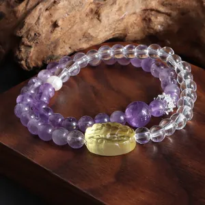 Bracelet double tour élégant en améthyste et cristal blanc avec breloque lion jaune et perle