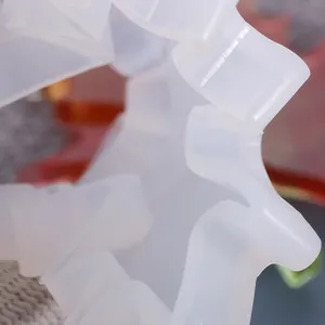 Close-up macro detail of translucent white silicone resin mold for DIY leaf-shaped coasters