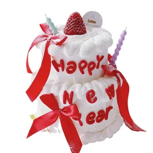 Festive soft glue New Year cake decoration with Happy New Year text and red ribbons