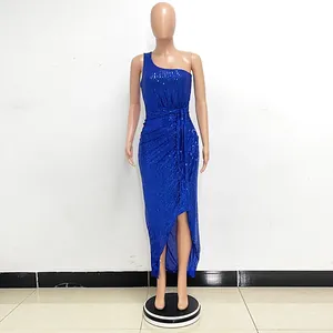 Elegant royal blue one-shoulder sequin dress with ruffles and side slit on mannequin