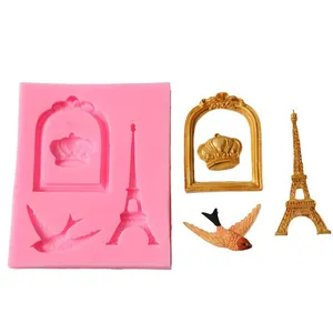 Silicone mold featuring Eiffel Tower and crown patterns with finished golden ornaments