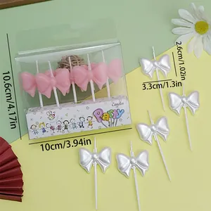 Pearlescent bow-shaped party candles detail with precise dimensions in cm and inches
