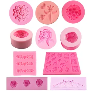 Variety of flower-shaped silicone molds for fondant and chocolate cake decoration.