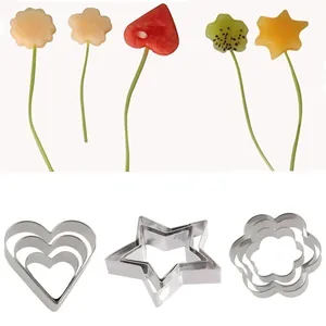 Set of stainless steel cookie cutters in heart, star, and flower shapes for fruit