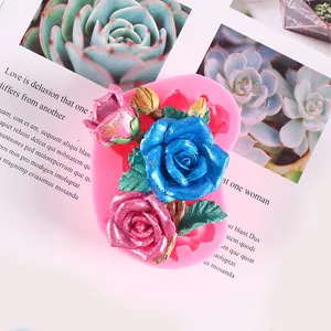 Detailed macro view of pink rose silicone mold and colorful finished resin flower crafts