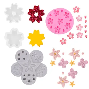 Detailed view of assorted floral silicone molds for fondant and chocolate cake decorations.