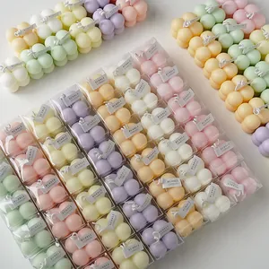 Velas aromáticas artesanales en forma de cubo de burbujas pastel en caja de regalo clara