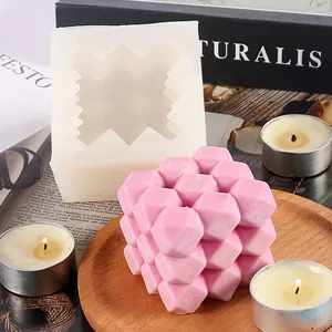 Close-up of rubik's cube silicone mold with finished pink geometric candle detail