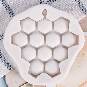 Macro detail view of white silicone honeycomb grape shape mold for fondant and chocolate
