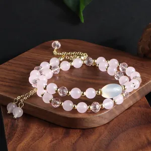 Professional macro view of a double-strand rose quartz bracelet featuring faceted crystal beads