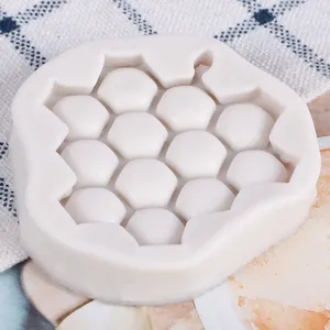 Macro view of a white honeycomb silicone mold for making fondant and chocolate crafts
