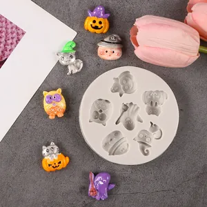 Silicone mold for Halloween themed resin crafts featuring pumpkins and cute ghosts