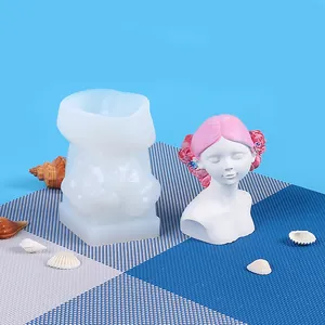 Detail of rose girl silicone mold with a finished plaster bust statue accessory.