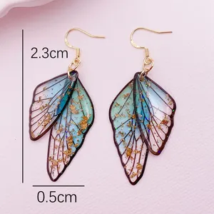 Detailed view of cicada wing earrings with 2.3cm height and gold foil accents