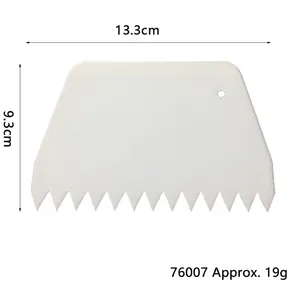White serrated plastic cake scraper 13.3cm width and 9.3cm height dimension details