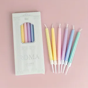 Detail of 6 colorful ribbed birthday candles with holders and Roma style packaging box
