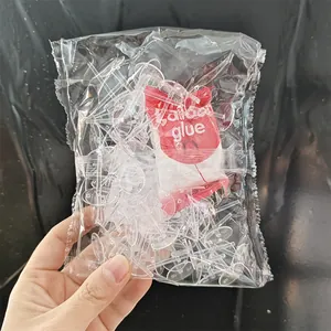 Großpackung transparenter Kunststoff-Tortenfigurenhalter mit einem Klebstoffbeutel