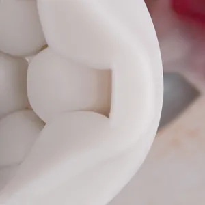 Close-up detail of honeycomb textured white silicone mold for fondant or chocolate.