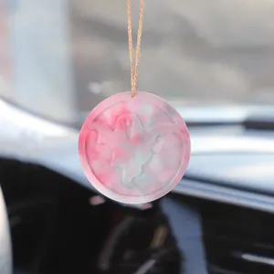 Detail view of pink marbled ghost car pendant ornament for Halloween decoration