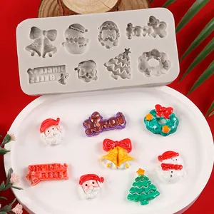 Macro detail of Christmas themed silicone mold and colorful finished resin ornaments
