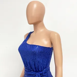 Detail shot of the shiny blue sequined one-shoulder evening dress fabric and texture