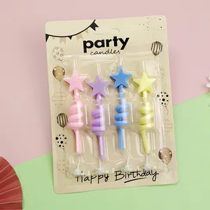 Close-up of 4pcs star-shaped twisted birthday candles in colorful retail packaging card