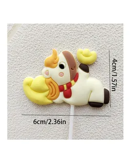 Macro detail of soft PVC horse cake topper with gold ingot and 6cm/4cm dimensions.