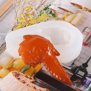 Detail view showing professional silicone mold and realistic faux chicken wing for DIY crafts