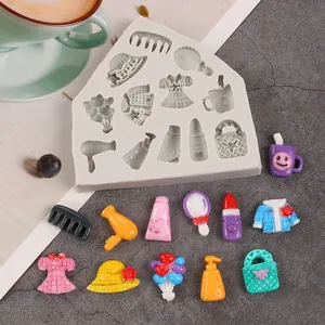 Detailed view of the white silicone mold with miniature fashion and accessories shapes for DIY