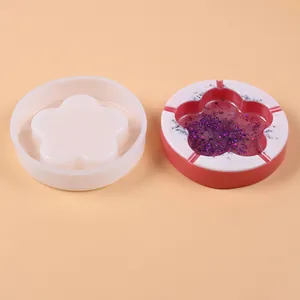 Side-by-side view of a plum flower silicone ashtray mold and its resin finished product