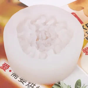 Detailed view of a carnation-shaped white silicone mold for DIY soap and candle making
