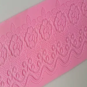 Detailed texture of pink silicone fondant lace mat for cake baking and decoration