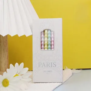 Decorative Paris-themed gift box containing 6 colorful spiral cake candles for party decor.