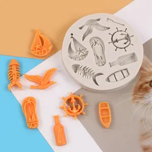 Detailed view of nautical silicone mold with various sea-themed orange resin pieces