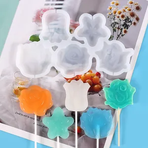Macro detail of flower-shaped silicone lollipop mold with colorful finished candy pops