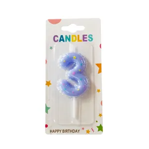 Detailed shot of a purple number 3 birthday candle featuring colorful star patterns for cake