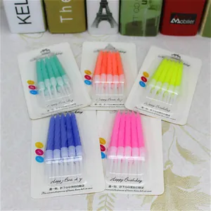 Close-up of multiple packs containing various colors of spiral birthday candles