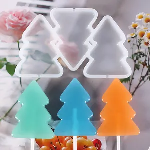Christmas tree silicone lollipop mold showing finished green, blue and orange candies