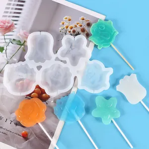 Close-up of multi-shape flower silicone lollipop mold showing colorful candy results