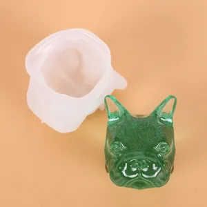 Detailed view of French Bulldog head silicone mold with translucent green resin cast